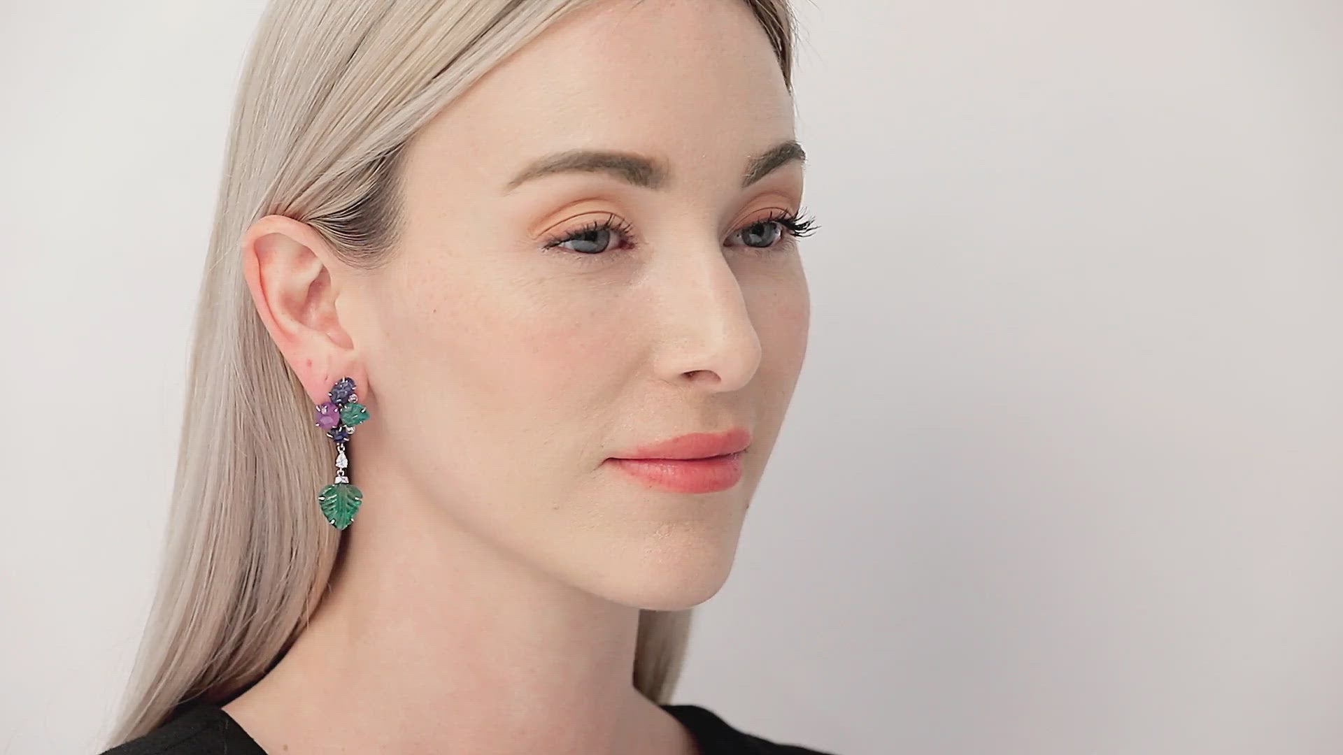 Load video: Carved Emerald and Sapphire Leaf Earrings in 18K White Gold