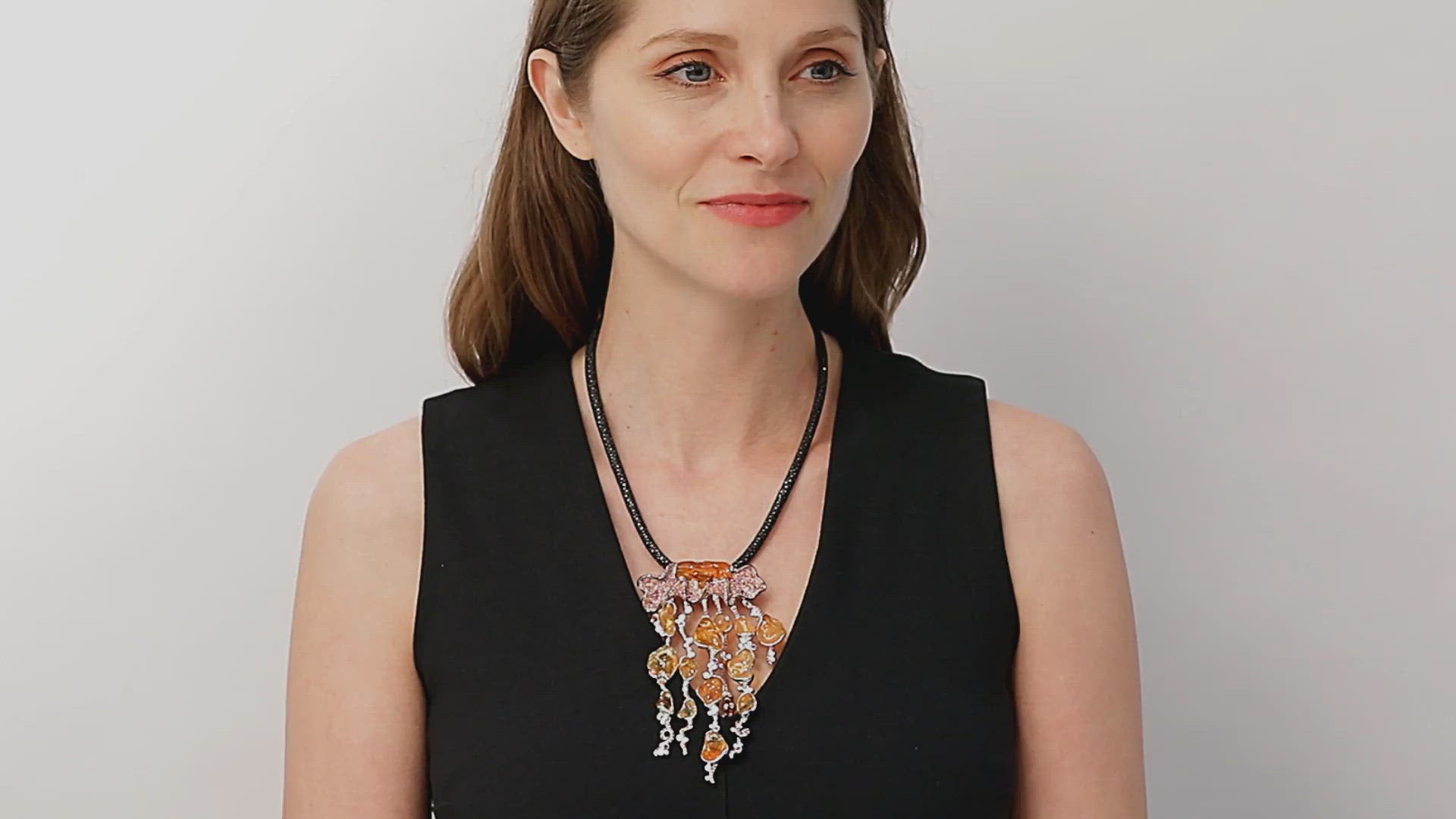 Load video: Carved Fire Opal Jellyfish Necklace by Patrick Mauboussin